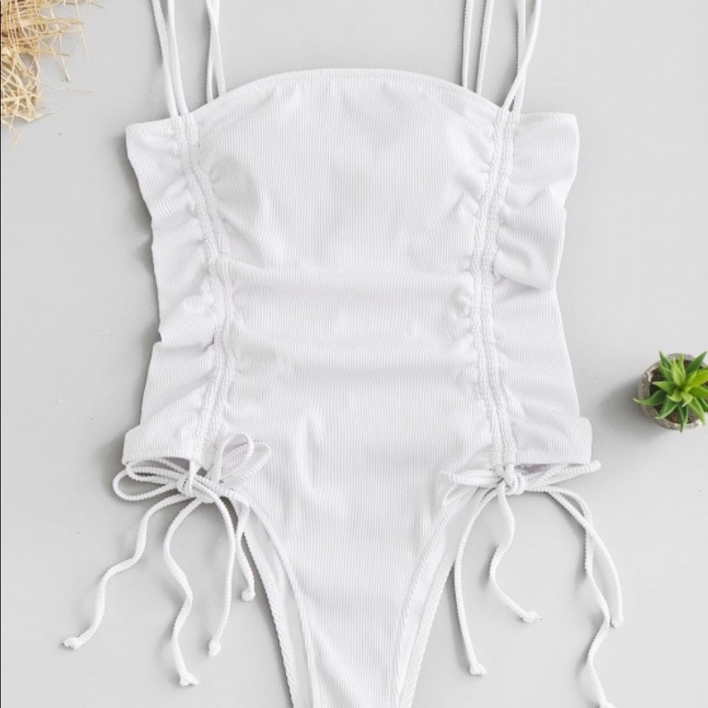 Cinched white one piece swimsuit